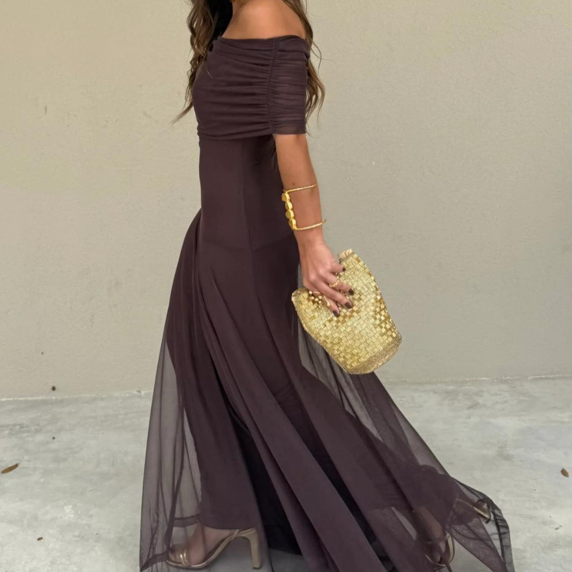 Flowy off-shoulder brown maxi dress for women, offering an elegant and romantic look for evening wear.