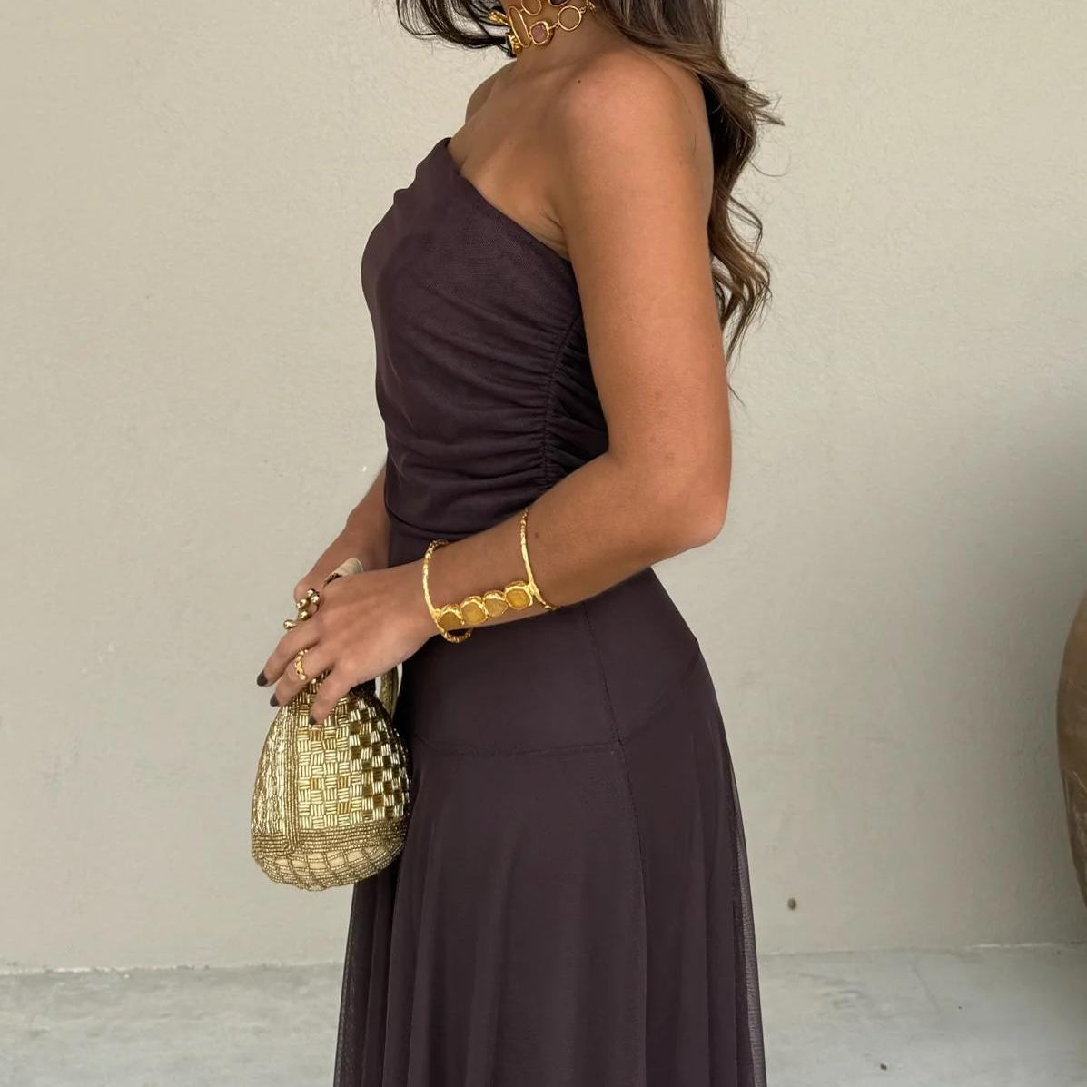 Beautiful women's off-shoulder brown maxi dress, a romantic flowy evening gown for wedding guests or parties.