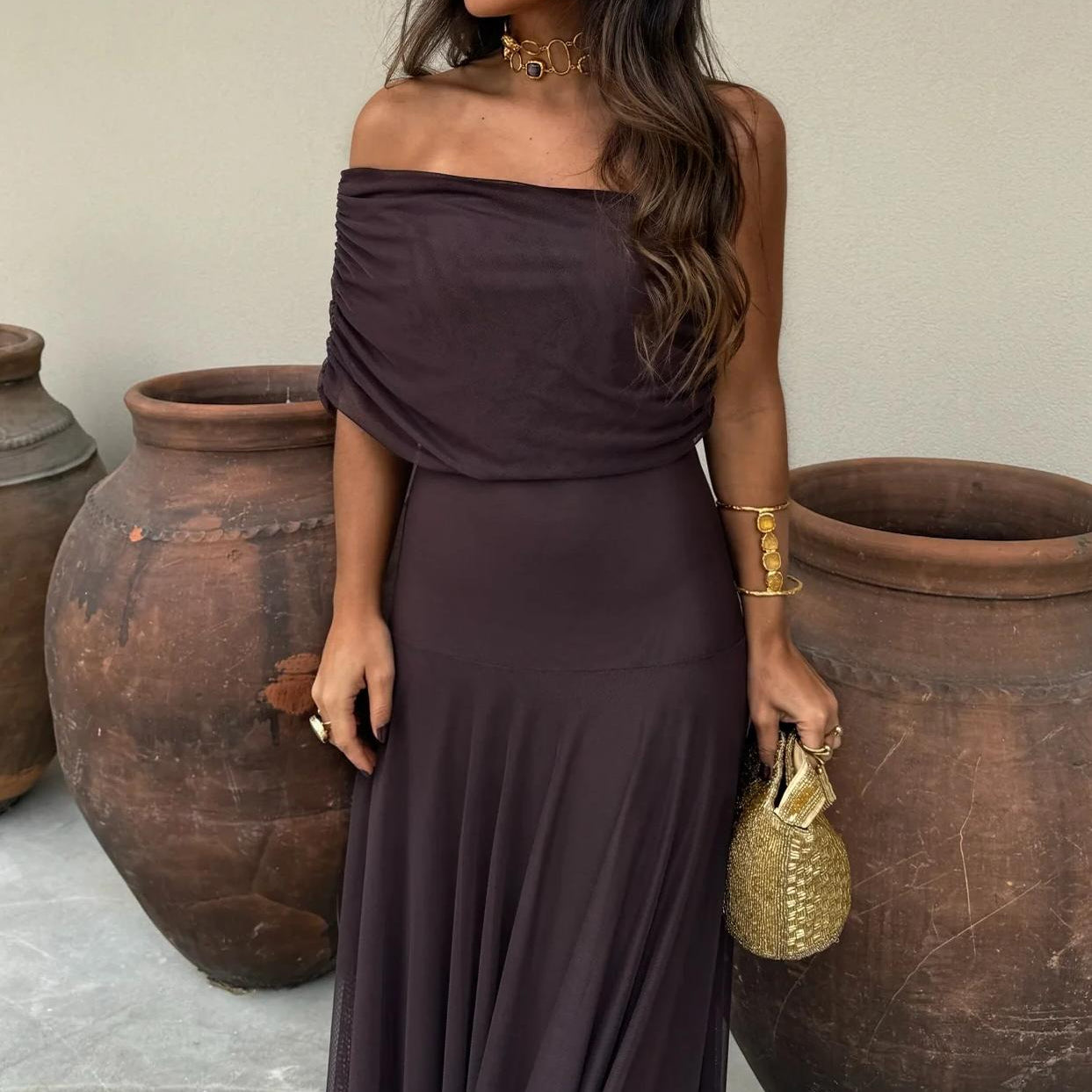Women's elegant brown off-shoulder maxi dress, a sophisticated flowy outfit for evening parties & celebrations.