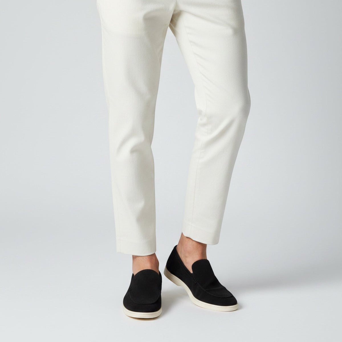 Modern men's slip-on loafers, stylish summer footwear for a sophisticated casual or smart-casual look.