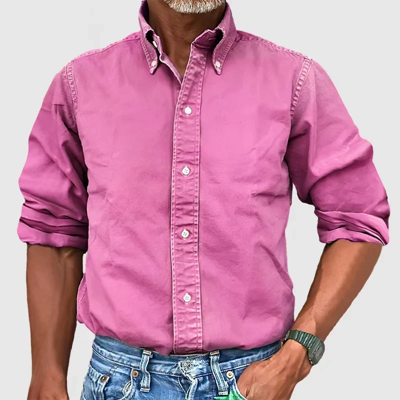 Texture shot of soft, breathable fabric on a men's classic long-sleeve shirt, emphasizing comfort.