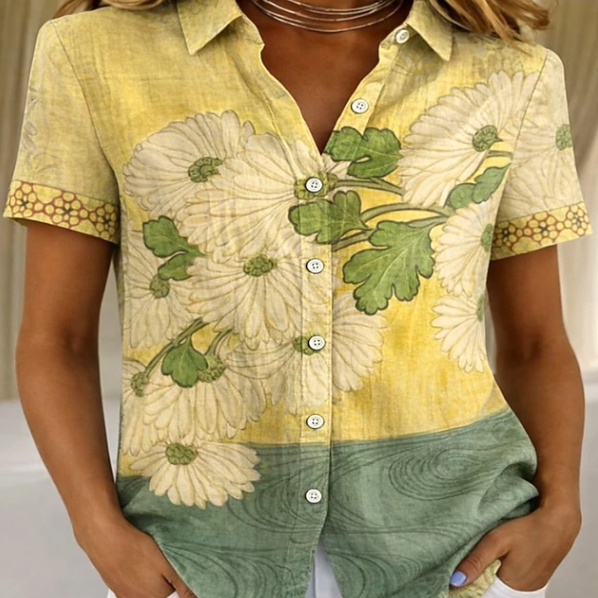 Front view of women's casual floral button-up shirt. Short sleeve summer blouse with vibrant print for fashion.