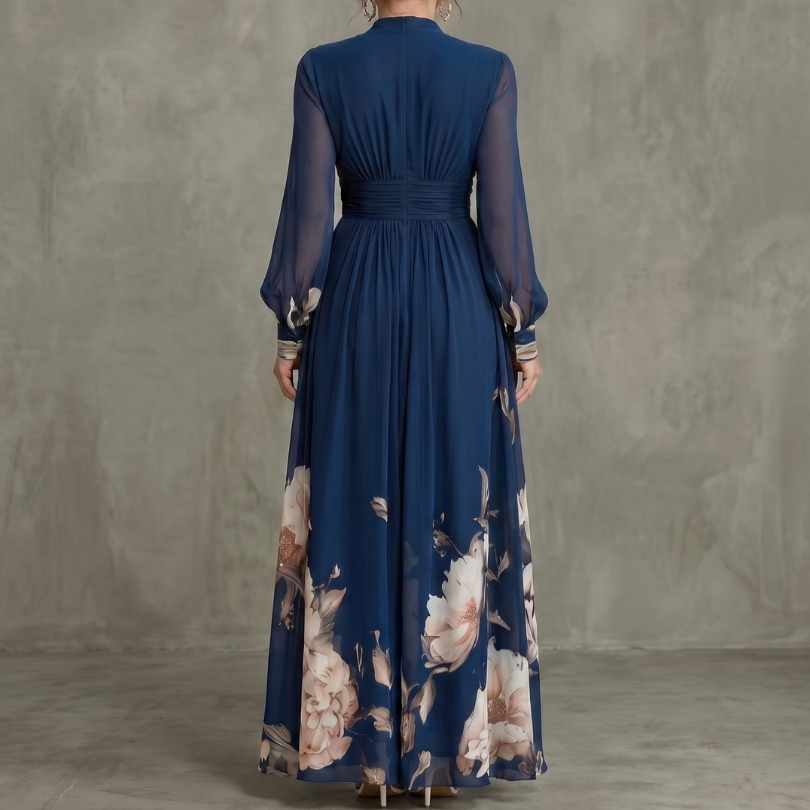 Full-length women's formal pleated maxi dress in navy, showcasing sheer long sleeves & a graceful silhouette.