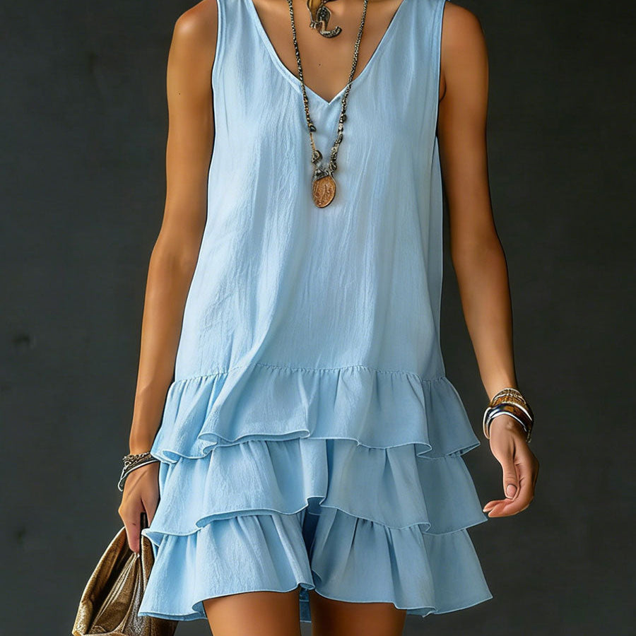 Stylish women's tiered mini dress with playful ruffles. A sleeveless V-neck for a relaxed summer look.