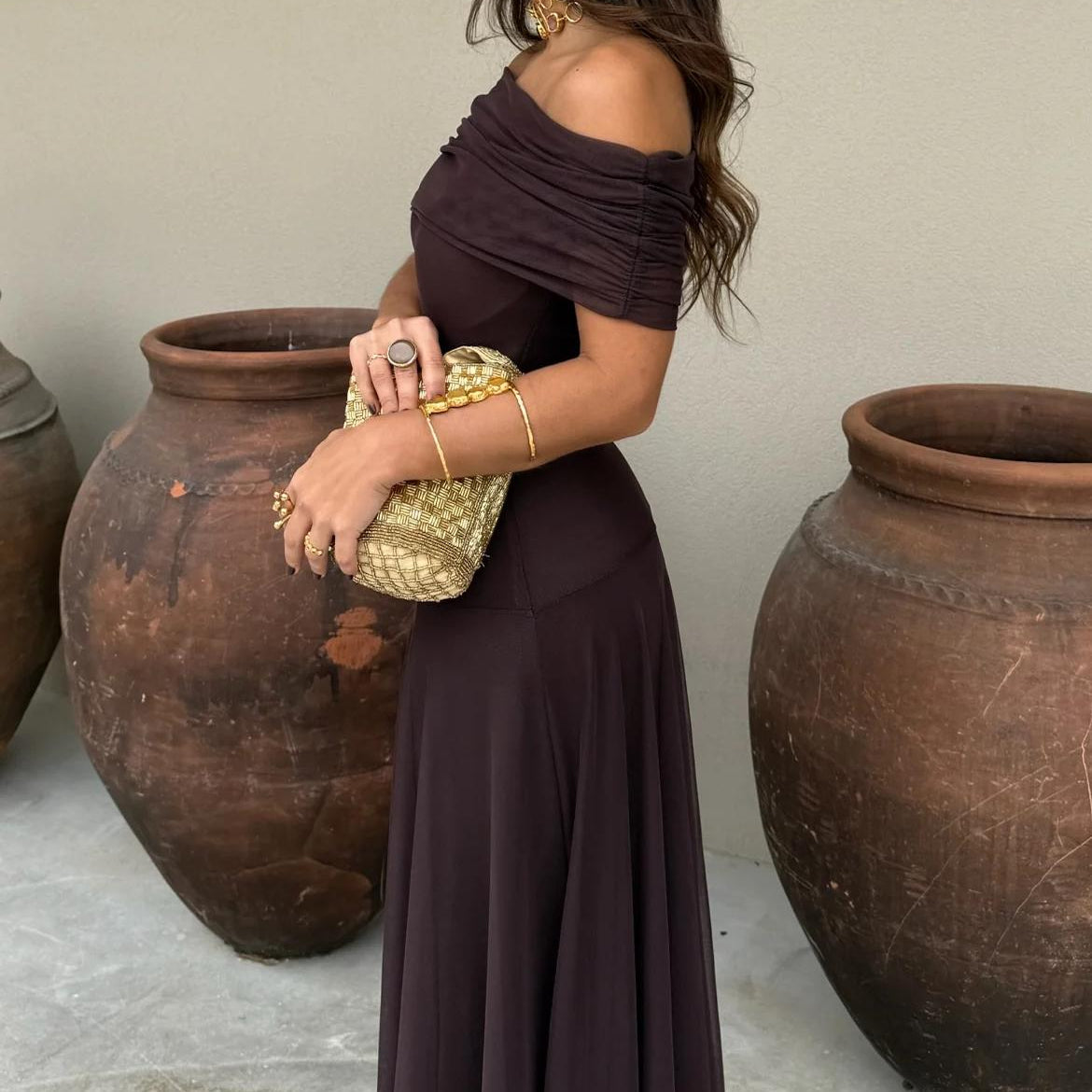 Chic women's brown off-shoulder maxi dress, elegant occasion wear for evening events, parties, and dinners.