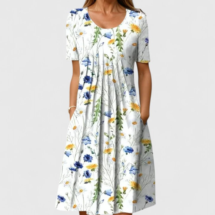 Elegant women's floral summer midi dress with short sleeves and practical pockets, perfect for casual or party wear.