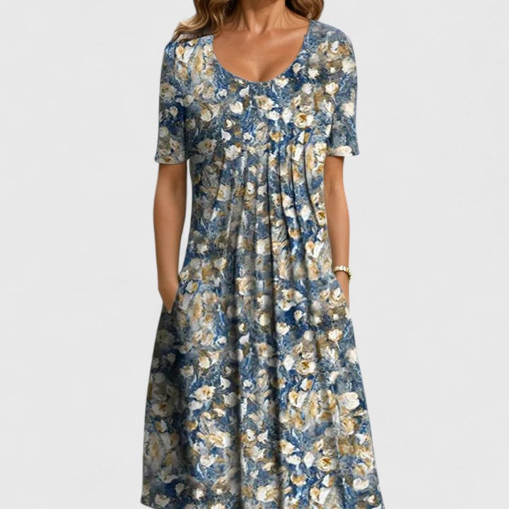 Versatile women's floral summer midi dress; short sleeve, comfortable, with pockets. Ideal for parties or casual outings.