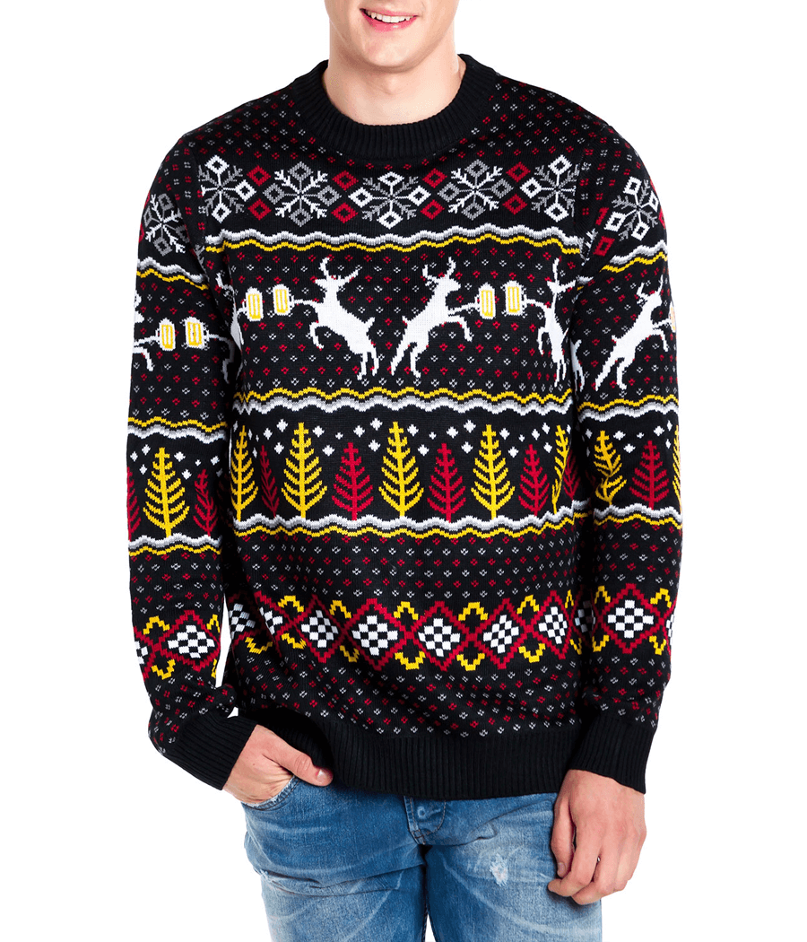 Person wearing a festive sweater with reindeer and snowflake pattern on a white background