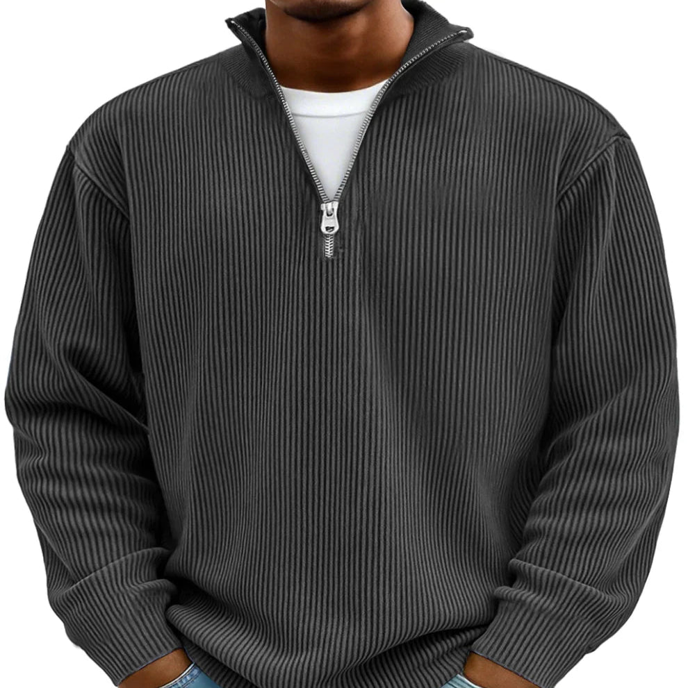 Casual men's half-zip sweater featuring a distinct ribbed knit, suitable for easy layering.