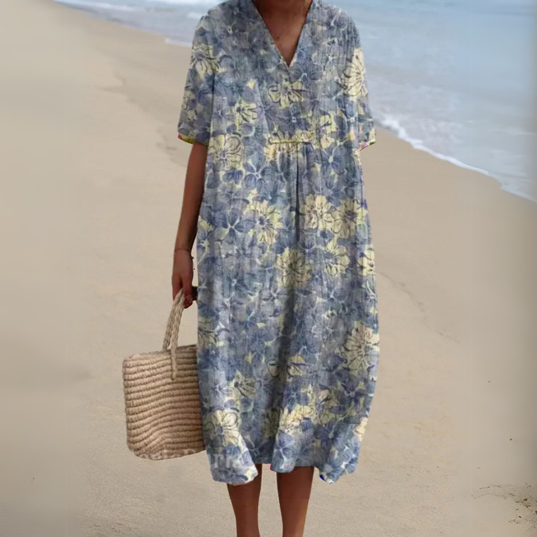 Full length view of a stylish women's multicolour V-neck floral dress, elegant and modern.