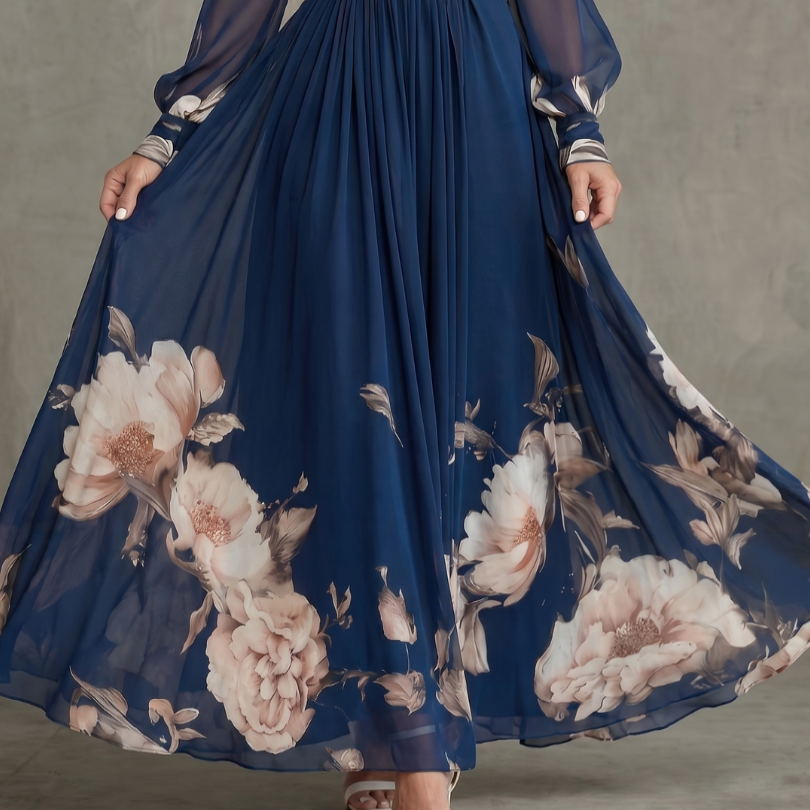 Comfortable women's navy maxi dress, featuring a flattering V-neck, pleated skirt, and delicate sheer sleeves.