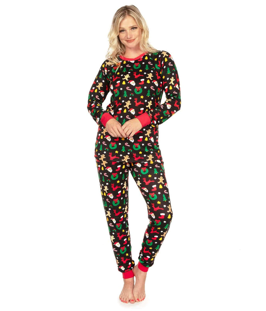 Woman wearing a festive pajama set with a white background